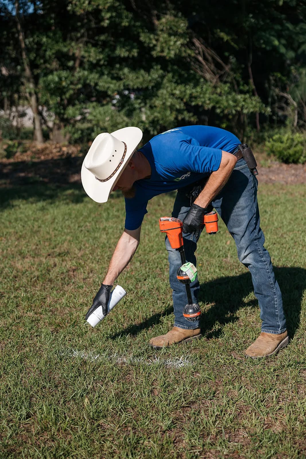 Dr Rooter technician locating an underground line